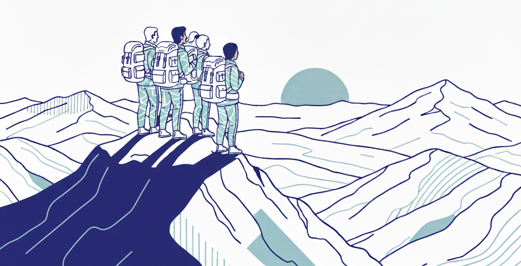 team of explorers with backpacks standing together at the top of a mountain range